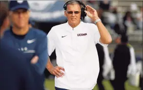  ?? Jessica Hill / Associated Press ?? UConn coach Randy Edsall walks the sideline during the second half of a game in 2019 against Illinois in East Hartford.