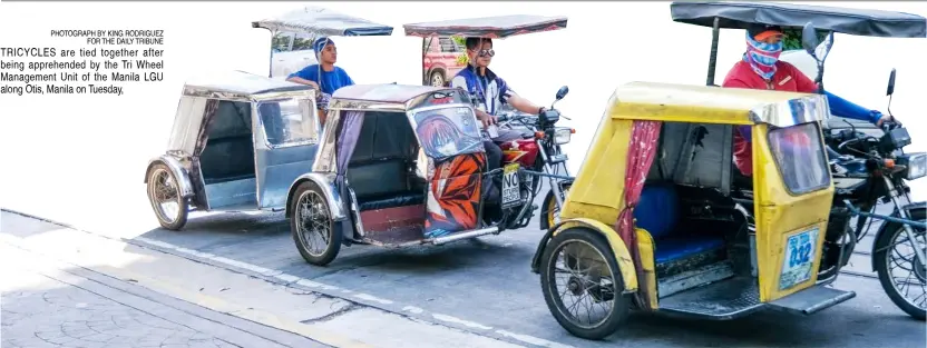  ?? PHOTOGRAPH BY KING RODRIGUEZ FOR THE DAILY TRIBUNE ?? TRICYCLES are tied together after being apprehende­d by the Tri Wheel Management Unit of the Manila LGU along Otis, Manila on Tuesday,