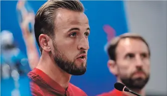  ?? ALASTAIR GRANT THE ASSOCIATED PRESS ?? England’s Harry Kane answers a question at a news conference for the 2018 soccer World Cup in Volgograd, Russia, on Sunday. England plays Tunisia in a group G match Monday.