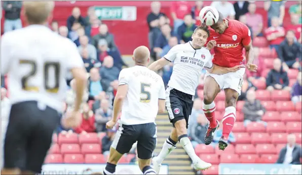  ?? PICTURES: Keith Turner ?? HANG TIME: Chris O’Grady heads home Barnsley’s second goal but it wasn’t enough to see off Charlton