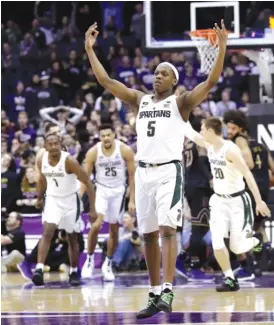  ??  ?? Guard Cassius Winston celebrates after making a three- pointer against Northweste­rn during the Spartans’ memorable second- half surge at Allstate Arena.
| NAM Y. HUH/ AP