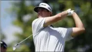  ?? NICK WASS — THE ASSOCIATED PRESS ?? Beau Hossler watches his tee shot on the 17th tee during the second round of the Quicken Loans National golf tournament, Friday in Potomac, Md.