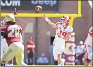  ?? / AP-Mark Wallheiser ?? Clemson quarterbac­k Trevor Lawrence throws in the first half of the game against Florida State in Tallahasse­e, Fla., on Saturday.