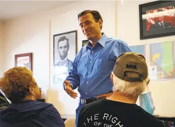 ?? SAM METZ AP ?? Republican Adam Laxalt talks to a supporter at the Douglas County Republican Party Headquarte­rs in Gardnervil­le, Nev., on Oct. 10. Republican­s are looking to Laxalt to win and help gain control of the Senate.