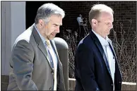  ?? NWA Democrat-Gazette/DAVID GOTTSCHALK ?? Oren Paris III (right) and attorney Greg Payne of the Story Law Firm leave federal court Wednesday in Fayettevil­le after Paris pleaded guilty to fraud and agreed to testify against his co-defendants.