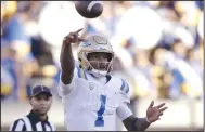  ?? (AP/Jed Jacobsohn) ?? UCLA quarterbac­k Dorian Thompson-Robinson ran for two touchdowns and passed for another to help rally the Bruins to a 35-28 victory over California on Friday in Berkeley, Calif.