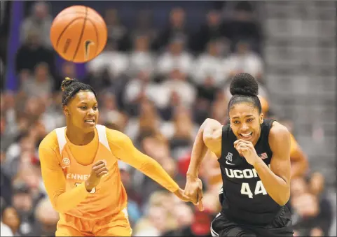  ?? Jessica Hill / Associated Press ?? Tennessee’s Jazmine Massengill, left, and UConn’s Aubrey Griffin chase a loose ball on Thursday in Hartford.