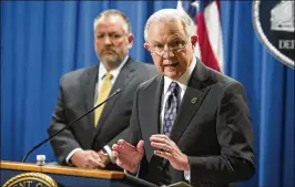  ?? CLIFF OWEN / AP ?? Attorney General Jeff Sessions (right) and acting Drug Enforcemen­t Administra­tion head Robert Patterson make an announceme­nt about new tools to combat the opioid crisis, at the Justice Department in Washington on Wednesday.