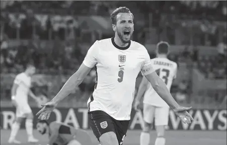  ?? REUTERS ?? Harry Kane celebrates scoring for England in the fourth minute of Saturday’s Euro 2020 quarterfin­al against Ukraine. Kane also found the net in the second half, with Harry Maguire and Jordan Henderson also on the scoresheet, as England won 4-0 in Rome.