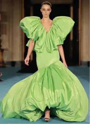  ??  ?? DRAMATIC SILHOUETTE: Puffed sleeves and skirt stand out on a Christian Siriano gown at the designer’s show at Gotham Hall.