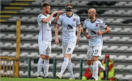  ?? Picture: Shuttersto­ck ?? Jake O’Brien, in face mask, celebrates scoring a goal for RWD Molenbeek