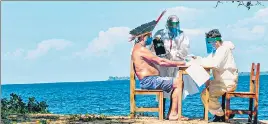  ?? AFP ?? An indigenous chief takes a coronaviru­s test on the banks of the lower Tapajos River in Brazil.