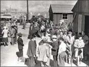  ?? AP ?? The first Japanese Americans arrive at the incarcerat­ion camp in Manzanar on March 23, 1942.