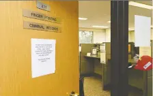  ?? TROY FLEECE/FILES ?? The Regina Police Service has a separate office for criminal record checks. Adults in foster care homes have to self-declare if they have been subject of a criminal charge by filling out a form annually. The provincial auditor found that no such paperwork had been filed in eight of 30 files her office examined.