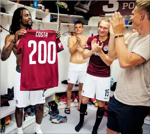  ??  ?? Costa Nhamoinesu (left) being applauded by his teammates for the 200th club appearance milestone