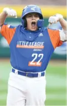  ?? GETTY IMAGES ?? Michigan’s Jackson Surma, who had four RBI, is pumped up after hitting a two-run single in the fifth inning.