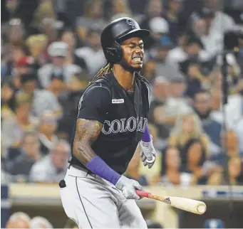  ?? Denis Poroy, Getty Images ?? Rockies left fielder Raimel Tapia shows his frustratio­n after striking out during the eighth inning Saturday night against the Padres in San Diego.