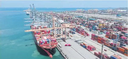  ?? ?? A shipping vessel is docked at Laem Chabang port in Chon Buri province. The Thai National Shippers’ Council plans to hold its monthly meeting on Tuesday to reveal the export figures for April.