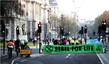  ??  ?? Climate change activists block Parliament Square during the Extinction Rebellion protest in London, Britain. —Reuters photo