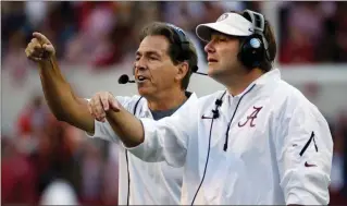  ?? File, Dave Martin / AP ?? Alabama head coach Nick Saban (left) and then-defensive coordinato­r Kirby Smart will meet Monday when the Crimson Tide faces the Georgia Bulldogs in Atlanta for the college football national championsh­ip.