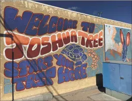  ?? PHOTOS BY DAVID ALLEN — STAFF ?? A mural touts Joshua Tree’s relaxed and somewhat psychedeli­c desert vibe.