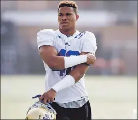  ?? Luis Sinco Los Angeles Times ?? KENNY YOUNG has big shoes to fill as he replaces Butkus Award winner Eric Kendricks on UCLA’s defense. Young is known to be mature beyond his age.