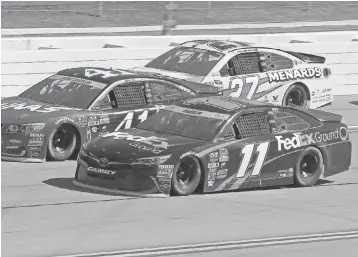  ?? MARVIN GENTRY, USA TODAY SPORTS ?? Denny Hamlin ( 11), heading to a third- place finish Sunday at Talladega Superspeed­way, moves on in the Chase for the Sprint Cup after winning a tiebreaker vs. Austin Dillon.