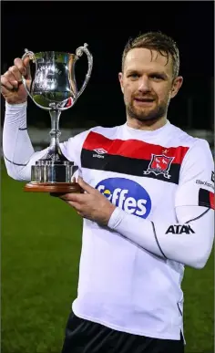  ??  ?? Dane Massey of Dundalk with the Jim Malone Cup.