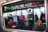  ?? (AP Photo/John Minchillo, File) ?? Some people wear masks while riding a subway on April 7 in New York. New York’s mass transit agency wants Apple to come up with a better way for iPhone users to unlock their phones without taking off their masks, as it seeks to guard against the spread of COVID-19 in buses and subways.