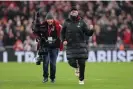  ?? Photograph: Jan Kruger/Getty Images ?? Jürgen Klopp and the cameraman of the hour.