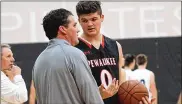  ?? CONTRIBUTE­D ?? Michael Basile said of coaching his son Grant at Pewaukee (Wisc.) High School: “I wish I would have taken time to enjoy it a little more.”