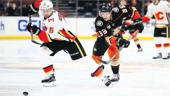  ?? SEAN M. HAFFEY/GETTY IMAGES ?? Mark Giordano and the Calgary Flames visited Jakob Silfverber­g and the Anaheim Ducks Wednesday. For game coverage, go to calgaryher­ald.com/sports.