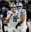  ?? MICHAEL AINSWORTH — THE ASSOCIATED PRESS ?? Detroit Lions quarterbac­k Jared Goff, left, talks with offensive tackle Taylor Decker before running a 2-point conversion play against the Dallas Cowboys during the second half of a game, on Saturday in Arlington, Texas.