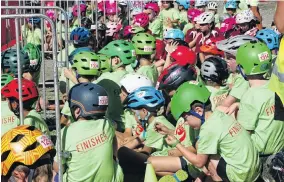  ??  ?? A sea of helmets . . . Waiting in ‘‘waves’’ yesterday are year 3 competitor­s in the Puzzling World Junior Challenge Wanaka at the start of their running and bike race in Rotary Park.