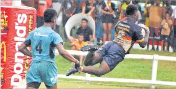  ?? ?? Dominion Brothers Youth Sireli Rokovailav­o dives in for a try against the Fiji U20 during their final.