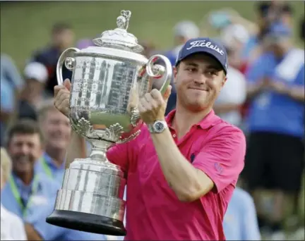  ?? CHRIS O’MEARA — THE ASSOCIATED PRESS ?? Justin Thomas poses with the Wanamaker Trophy after winning the PGA Championsh­ip Sunday in Charlotte, N.C.