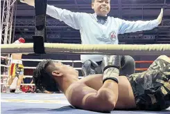  ?? ?? Referee Danrex Tapdasan waves off the fight as Thoedsak Sinam lies flat on his back after absorbing a left uppercut from Eumir Marcial.