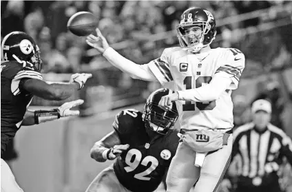  ?? JASON BRIDGE, USA TODAY SPORTS ?? Quarterbac­k Eli Manning threw two intercepti­ons in the Giants’ Week 13 loss to the Steelers.