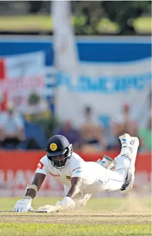  ??  ?? All over: Ben Foakes runs out Rangana Herath to complete England’s victory