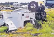  ?? CHRIS JONES ?? Police say a tractor-trailer hauling produce blew a tire on eastbound Interstate 40 and careered across the median, striking a Greyhound bus full of passengers.