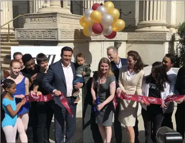  ?? PHOTOS BY SAL PIZARRO ?? San Jose City Councilman Raul Peralez and New Ballet Director Dalia Rawson cut the ribbon on the dance company’s new studios in the Corinthian Event Center in downtown San Jose on Saturday.