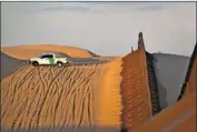  ?? Matt York Associated Press ?? A TRUCK patrols the U.S.-Mexico border in July. A former federal agent has pleaded guilty to using his authority to intimidate and harass a personal enemy.