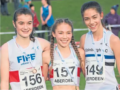  ??  ?? East of Scotland cross country U15 girls medallists (from left) Anna Dalglish (Fife AC), Anna Hedley (Fife AC) and Katie Johnson (Edinburgh AC).