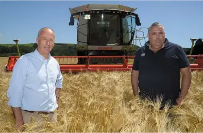  ?? PHOTO: DENIS BOYLE ?? Getting ready to start harvesting winter barley at Ballincour­ta, Belgooly, Co Cork were farmer and contractor Andre O’Mahony and Alan Coleman.