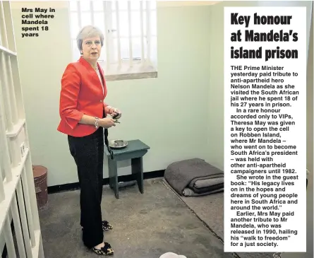  ?? Pictures: STEFAN ROUSSEAU/PA ?? Mrs May in cell where Mandela spent 18 years