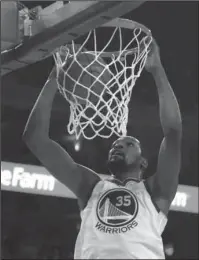  ?? The Associated Press ?? THROWING IT DOWN: Golden State forward Kevin Durant scores against the San Antonio Spurs Saturday during the Warriors’ 113-92 win Saturday in Oakland, Calif., to open the first round of the NBA playoffs.