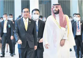  ?? GOVERNMENT HOUSE ?? Prime Minister Prayut Chan-o-cha welcomes Saudi Arabia’s Crown Prince Mohammed bin Salman to the Apec Leaders’ Informal Dialogue with Guests forum.