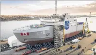  ?? CP PHOTO ?? The Royal Canadian Navy’s first Arctic and Offshore Patrol Ship (AOPS), the future HMCS Harry DeWolf, is assembled at Irving Shipbuildi­ng’s Halifax Shipyard on Friday.