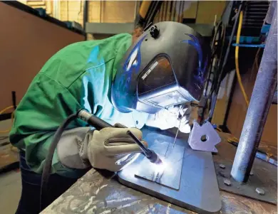  ?? MARK HOFFMAN/MILWAUKEE JOURNAL SENTINEL ?? Michelle Moldenauer practices TIG welding at Milwaukee Area Technical College in West Allis. Moldenauer is going for her associate’s degree in welding, but the pandemic has left her uncertain about her plan.