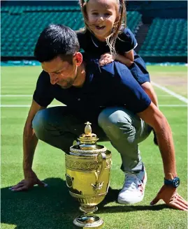  ?? ?? Who’s the daddy? Djokovic and daughter Tara yesterday